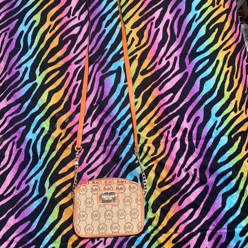 A orange Michael Kors purse